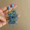 Detailed macro view of seaside style blue handmade beaded flower drop earrings - Beaded Flower Drop Style / Blue Green