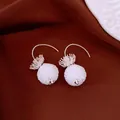 Handmade white beaded ball drop earrings with silver hook and crown detail for women - Style 67
