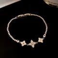 Close-up of 18k gold plated zircon flower bracelet with elegant sparkling stones. - Flower Style (HB5287) / Silver
