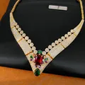 Close-up of vintage 18k gold plated necklace with red and multi-color zircons - Gold-Multicolor