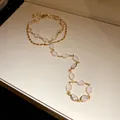 Close-up of vintage gold double-layer slave bracelet with elegant oval resin stones - Double Layer Hand Chain Style / Gold Multicolor