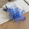 Exquisite close-up of blue fabric flower hair clip with butterfly and pearl details. - Duckbill Clip (Single Piece) / Blue