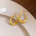 Exquisite goldfarbene, verdrehte ovale Creolen im Vintage-Stil mit minimalistischem Design - Gold
