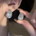 Close-up of elegant teardrop stud earrings encrusted with sparkling cubic zirconia - Silver