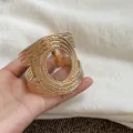 Vintage style gold wide cuff bracelet with a unique multi-layer twisted wire design - Gold