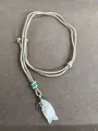 Woven cord necklace featuring a white fish-shaped stone pendant and heart charm - White