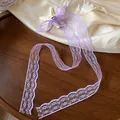 Dettaglio del fermaglio per capelli con fiocco in pizzo viola e stella marina - Pezzo Singolo (Stella Marina Nappina Fiocco) / Fermagli per capelli a becco d'anatra / Viola e Bianco