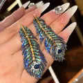 Detailed shot of vintage peacock feather earrings with colorful micro-set zircons - Gradient Feather Style / Silver Needle / 8# Silver Blue Green
