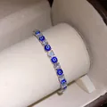 Detailed view of silver evil eye bracelet with sparkling cubic zirconia stones. - Gold-Blue