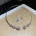 Elegante set gioielli a goccia argento con girocollo di strass e orecchini pendenti - Set collana e orecchini / Argento