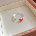 Detail view of a silver-colored strawberry and star open ring in a pink gift box. - Star Strawberry Style / Silver