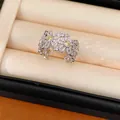 Detailed view of an elegant flower ring with white and yellow cubic zirconia. - Hollow Flower Style (HR3610) / Silver