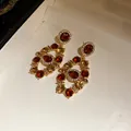 Exquisite macro detail of vintage court style dangle earrings with red and amber crystals - Earrings Only (Silver Earring Post) / Dark Coffee