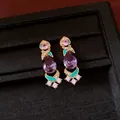 Macro detail of vintage gold-plated earrings with purple pear zircon and teal enamel. - Silver Earring Post Earrings / Gold-Purple