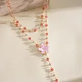 Close-up of a pink resin flower necklace with sparkling rhinestones in gold finish. - Pink Floral (Double Layered) / Gold
