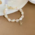 Close-up of elegant baroque freshwater pearl bracelet with gold chain and tree charm - 18# Bracelet-Gold-Tree Antler