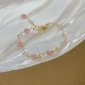 Detail view of handmade freshwater pearl and pink strawberry quartz beaded gold bracelet - 19# Bracelet-Gold-Pink Strawberry Crystal