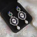 Detailed close-up of vintage Evil Eye drop earrings featuring crystals and pearls. - Evil Eye Style (HE33099) / Gold