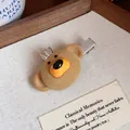 Detailed close-up of a cute brown flocked bear hair clip with a tiny silver crown on top. - Bear Duckbill Clip / 1 Piece / Brown