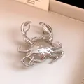 Detailed view of a metallic silver crab brooch with high-shine reflective finish texture - Brooch / Silver
