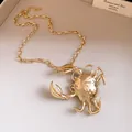 Detailed view of a chunky gold chain necklace featuring a textured 3D crab pendant. - Necklace / Gold