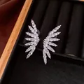 Elegant silver-tone wing-shaped clip-on earrings with shimmering cubic zirconia - Clip-On Earrings / Silver