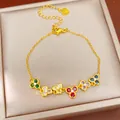 Close-up of elegant gold flower bracelet featuring vibrant colorful zircon stones - Gold Multicolor