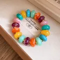 Vibrant colorful marble pattern acrylic beaded bracelet with gold spacers detail view - Bracelet / Colorful
