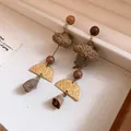 Handcrafted vintage forest style earrings with wooden beads and mushroom accents. - Retro Leaf Wood Bead Earrings / Silver Earring Post-Gold-Coffee
