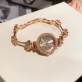 Elegant rose gold watch featuring a crystal-encrusted flower bracelet band for women - Bracelet Watch / Gold