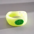 Close-up of vibrant green dopamine style geometric bangle with dripped oil texture detail - Green