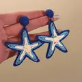 Detailed view of woven blue and white starfish earrings for summer vacation style - 1# (Starfish Style)