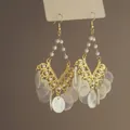 Detailed close-up of bohemian style gold earrings with white shell discs and pearls. - 4# (Lace Pearl Style)
