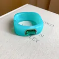 Detail shot of turquoise resin square bracelet with emerald green gemstone embellishment - Green