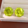 Macro detail of elegant lime green rose flower stud earrings with 18K gold plating finish - Green