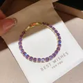Close-up of elegant gold tennis bracelet featuring sparkling round purple zircons - 28# Bracelet