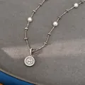 Macro view of silver eight-pointed star zircon pendant necklace with elegant pearls - Octagram Clavicle Necklace