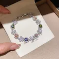 Detailed view of luxury colorful zircon flower bracelet on elegant white fabric pouch - 33# Bracelet