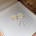 Close-up view of daisy flower and pearl stud earrings set in a cream jewelry box - Silver & White (Silver Earring Post)