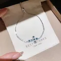 Close-up view of an elegant silver bracelet featuring green zircon flower details on pouch - 40# Bracelet