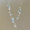 Double-layered beach vacation necklace with blue beads, faux pearls and starfish - Silver-Blue-Starfish