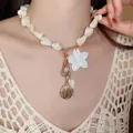 Elegant sea breeze vacation style faux pearl necklace with floral seashell charms - Gold-White