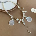 Elegant layered faux pearl necklace with round shell-like pendants for beach vacation - White