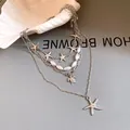Close-up of multi-layered silver necklace with pearls, sea stars, and turtle pendant - Multi-layer Starfish Turtle Necklace / Silver