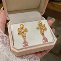 Elegant 18k gold plated flower stud earrings with pink teardrop zirconia stones. - Flower Shape / Gold Pink