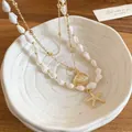 Elegant double layer necklace with seashell and starfish pendants in gold and white - Gold-White (3 Pieces Set)