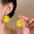 Vibrant yellow daisy stud earrings with silver needles and crystal centers for women - Vacation Style Daisy Studs / Yellow