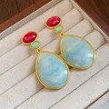 Close-up detail of vintage resin drop earrings featuring red and blue stones in a gold frame - Water Drop Style (HE32043) / Blue