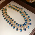Detail of vintage gold necklace with blue resin stones and sparkling rhinestones - Necklace Only (Without Earrings) / Blue
