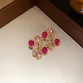 Detail of vintage gold earrings with pink resin stones and sparkling rhinestones - Earrings Only (Without Necklace) / Pink